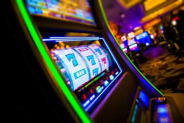 Live casino dealer at multi-camera table setup